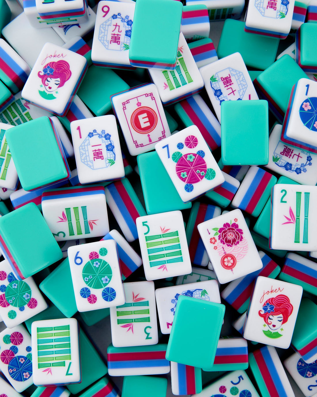 Oh My Mahjong Seabreeze Mahjong Tile Set featuring turquoise, coral pink, ocean blue, green and floral acrylic tiles.