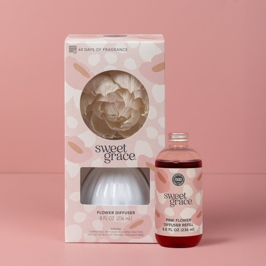 Sweet Grace flower diffuser set with packaging on a pink background