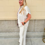 Oatmeal button-down top with gold trim, relaxed fit
