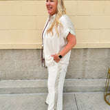 Oatmeal button-down top with gold trim, relaxed fit