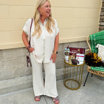 Oatmeal button-down top with gold trim, relaxed fit