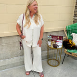 Oatmeal button-down top with gold trim, relaxed fit