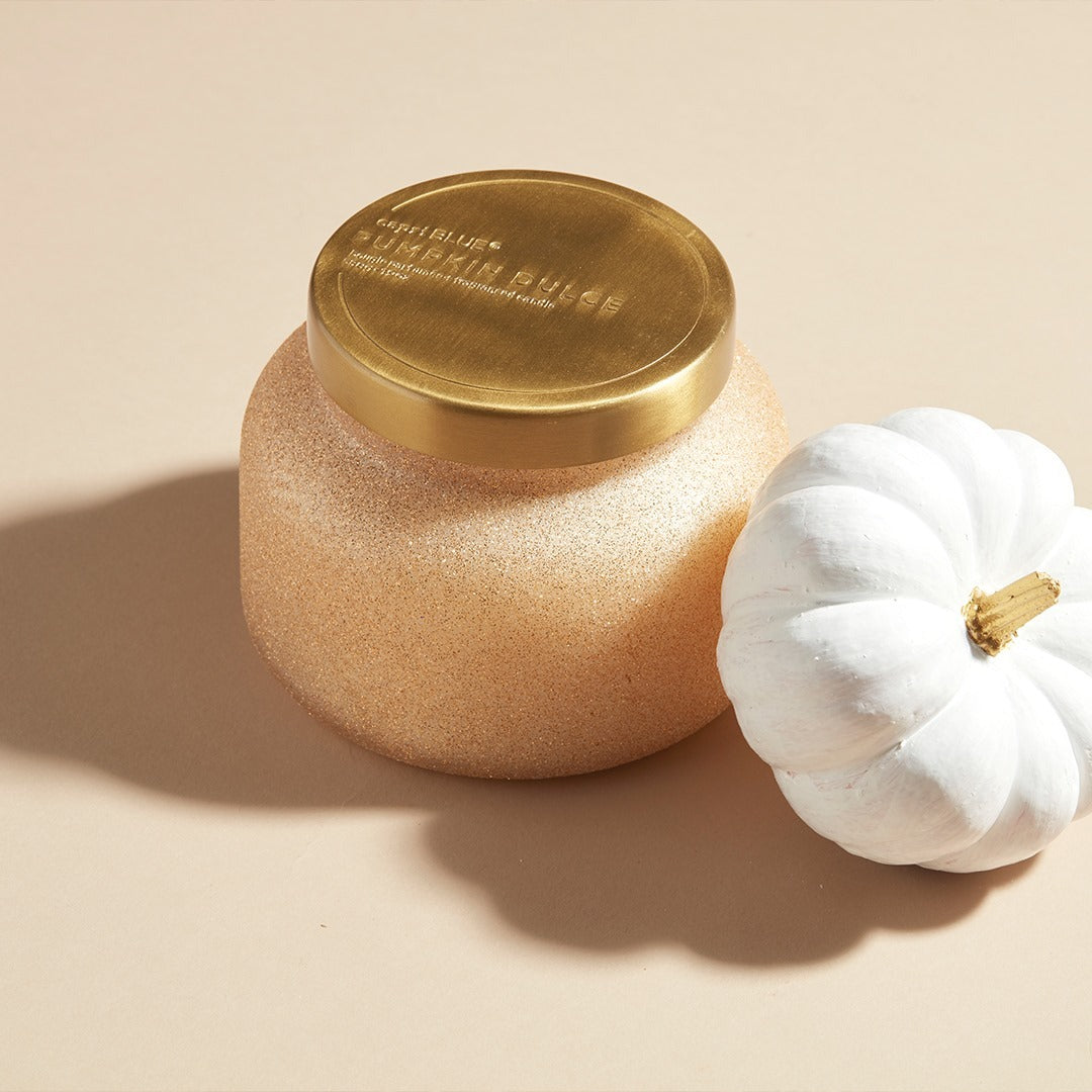 Pumpkin Dulce Glam Signature Candle 19oz in champagne glitter jar with pumpkin and vanilla fragrance.